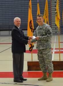 COL(Ret) Ed Murdock presenting a $500 Top Graduating Cadet Award to Cadet Collin Brackin, Shippensburg University ROTC.