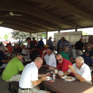 Golfers enjoying a great lunch, camaraderie, and prize drawings after the scramble.