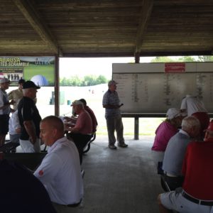 Chapter Board Member Ed Filiberti announcing golf scramble individual and team winners.